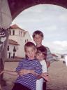 Us 3 kids under archway in Villa de Leyva, Colombia